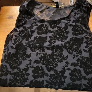 Torrid sheer body suit. Black with flowers. Snaps at the bottom. Never worn